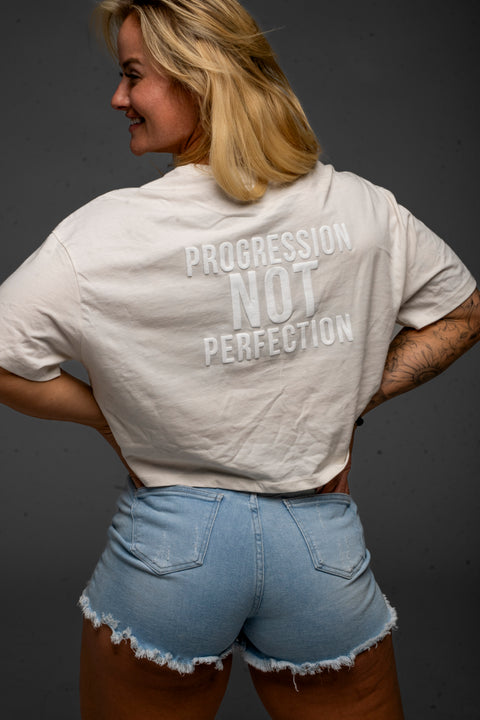 Progression Not Perfection Cropped Tee by Dani Speegle